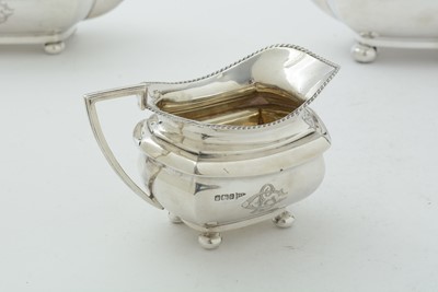 Lot 52 - An Edwardian three piece silver tea set and matching coffee pot