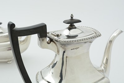 Lot 52 - An Edwardian three piece silver tea set and matching coffee pot