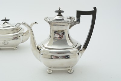 Lot 52 - An Edwardian three piece silver tea set and matching coffee pot