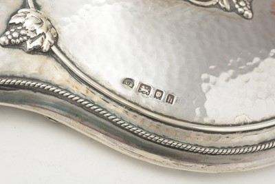 Lot 42 - A George V Arts and Crafts hand mirror