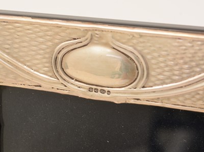 Lot 30 - Five various silver-mounted decorative photograph frames
