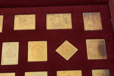Lot 6 - An Elizabeth II limited edition set of 25 silver-gilt replica postage stamps; and another
