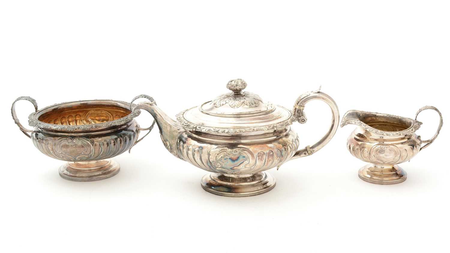 Lot 84 - A George III/IV Scottish silver three-piece tea service