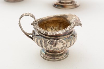 Lot 84 - A George III/IV Scottish silver three-piece tea service