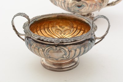 Lot 84 - A George III/IV Scottish silver three-piece tea service