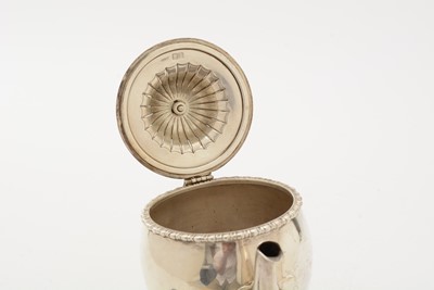 Lot 85 - ﻿A George V silver teapot and matching sugar bowl