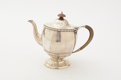 Lot 85 - ﻿A George V silver teapot and matching sugar bowl