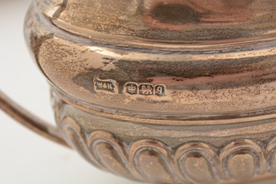 Lot 13 - A George V silver four piece tea set