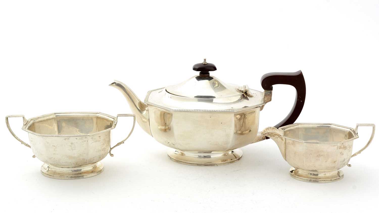 Lot 14 - An art deco silver three-piece tea set