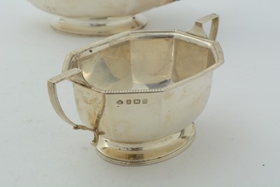 Lot 14 - An art deco silver three-piece tea set