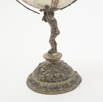 Lot 1401 - A 19th Century Continental silver and parcel-gilt mounted nautilus shell cup
