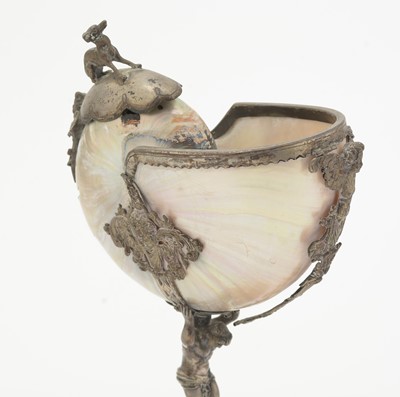 Lot 1401 - A 19th Century Continental silver and parcel-gilt mounted nautilus shell cup