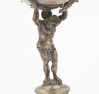 Lot 1401 - A 19th Century Continental silver and parcel-gilt mounted nautilus shell cup