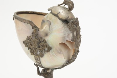 Lot 1401 - A 19th Century Continental silver and parcel-gilt mounted nautilus shell cup