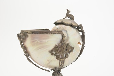Lot 1401 - A 19th Century Continental silver and parcel-gilt mounted nautilus shell cup