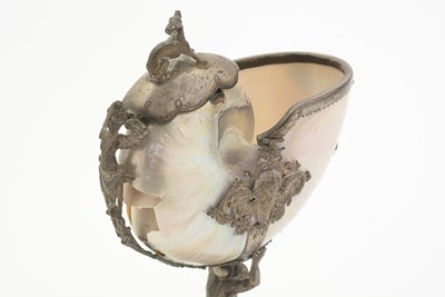 Lot 1401 - A 19th Century Continental silver and parcel-gilt mounted nautilus shell cup