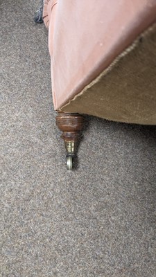 Lot 1 - Howard & Sons Ltd: A Victorian chaise longue upholstered in salmon pink fabric