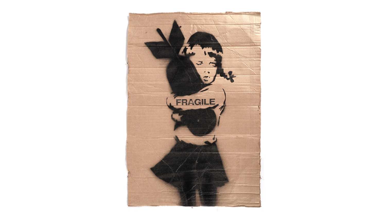 Lot 702 - BANKSY - "Bomb Hugger" / FRAGILE Anti-Iraq War Protest March Placard | spray paint on cardboard