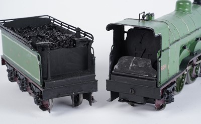Lot 244 - A metal kit-built 0-gauge 4-4-2 locomotive and six-wheel tender