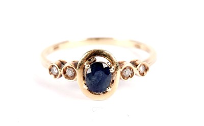 Lot 515 - A sapphire and diamond ring