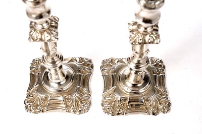 Lot 1358 - An Elizabeth II silver matched pair of cast tapersticks