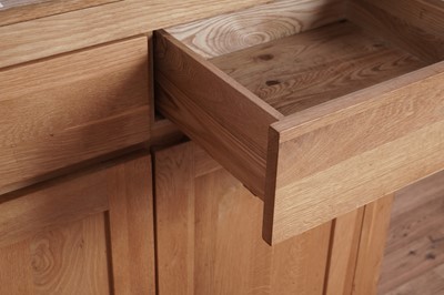Lot 37 - A contemporary eight-piece oak dining room suite