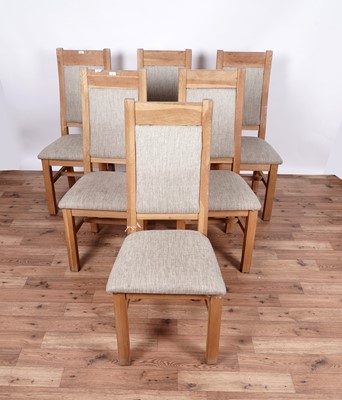 Lot 37 - A contemporary eight-piece oak dining room suite