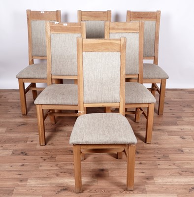 Lot 37 - A contemporary eight-piece oak dining room suite