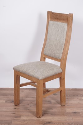 Lot 37 - A contemporary eight-piece oak dining room suite