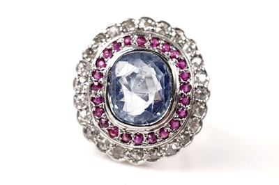 Lot 1119 - A sapphire, ruby, and diamond cluster ring
