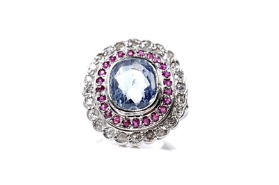 Lot 1119 - A sapphire, ruby, and diamond cluster ring