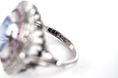 Lot 1119 - A sapphire, ruby, and diamond cluster ring