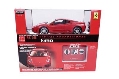 Lot 169 - A Tamiya Ferrari F2001 radio controlled car; and other Ferrari collectibles