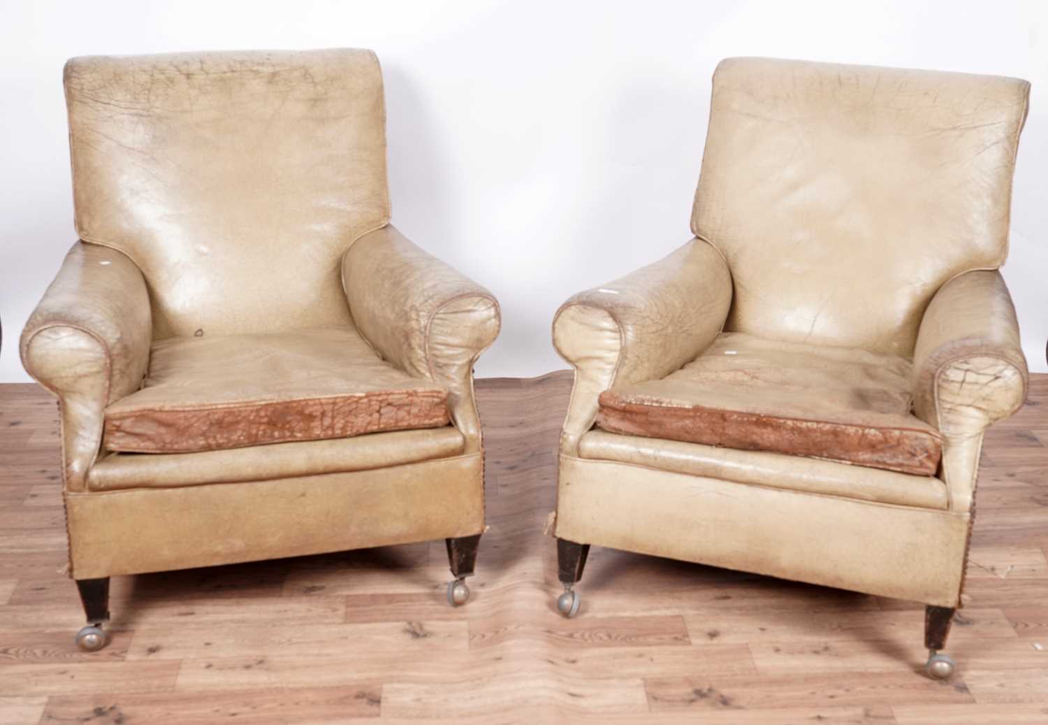 Lot 53 - A pair of early 20th Century leather armchairs with Archibald Kenrick castors