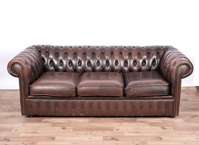 Lot 17 - A Chesterfield style sofa and armchair