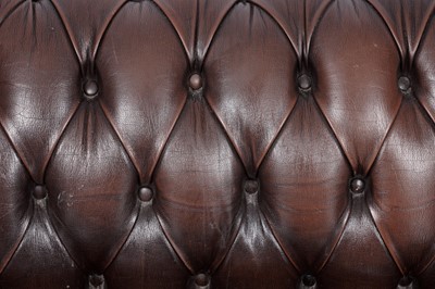 Lot 17 - A Chesterfield style sofa and armchair