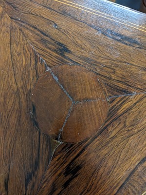 Lot 62 - An Edwardian inlaid rosewood triangular drop leaf occasional table