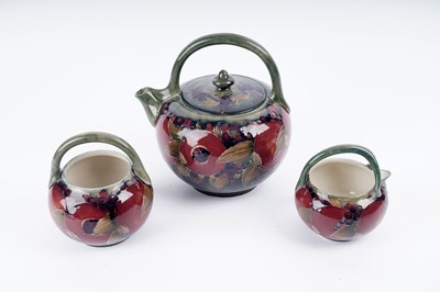 Lot 925 - A William Moorcroft three-piece tea set
