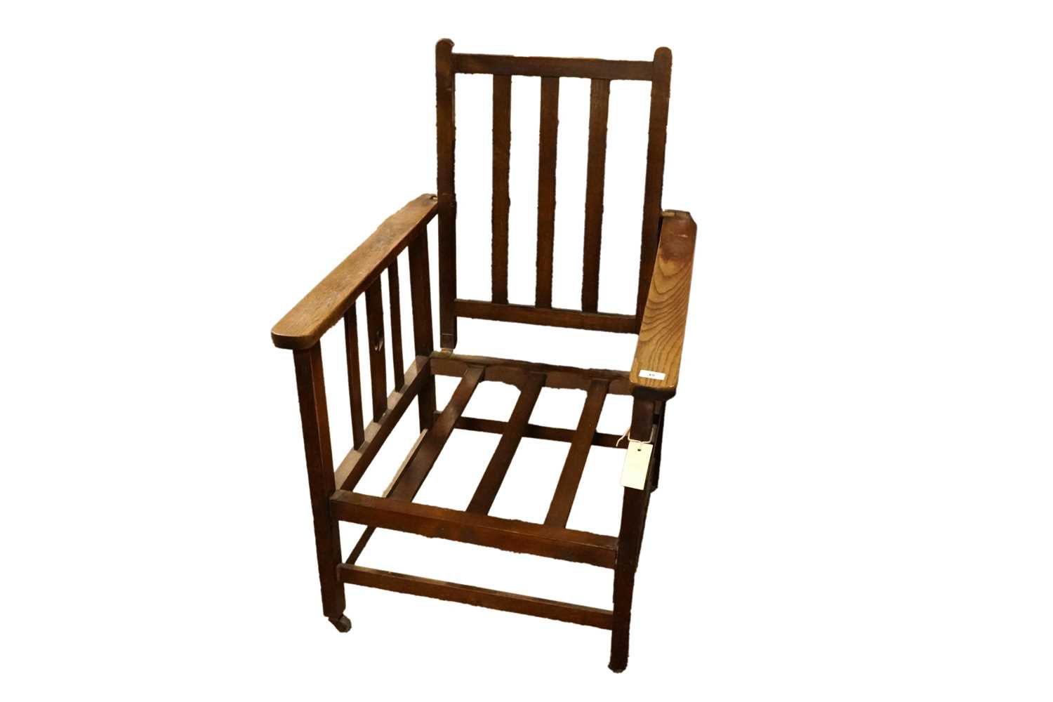 Lot 64 - An early 20th Century oak Arts and Crafts Campaign armchair