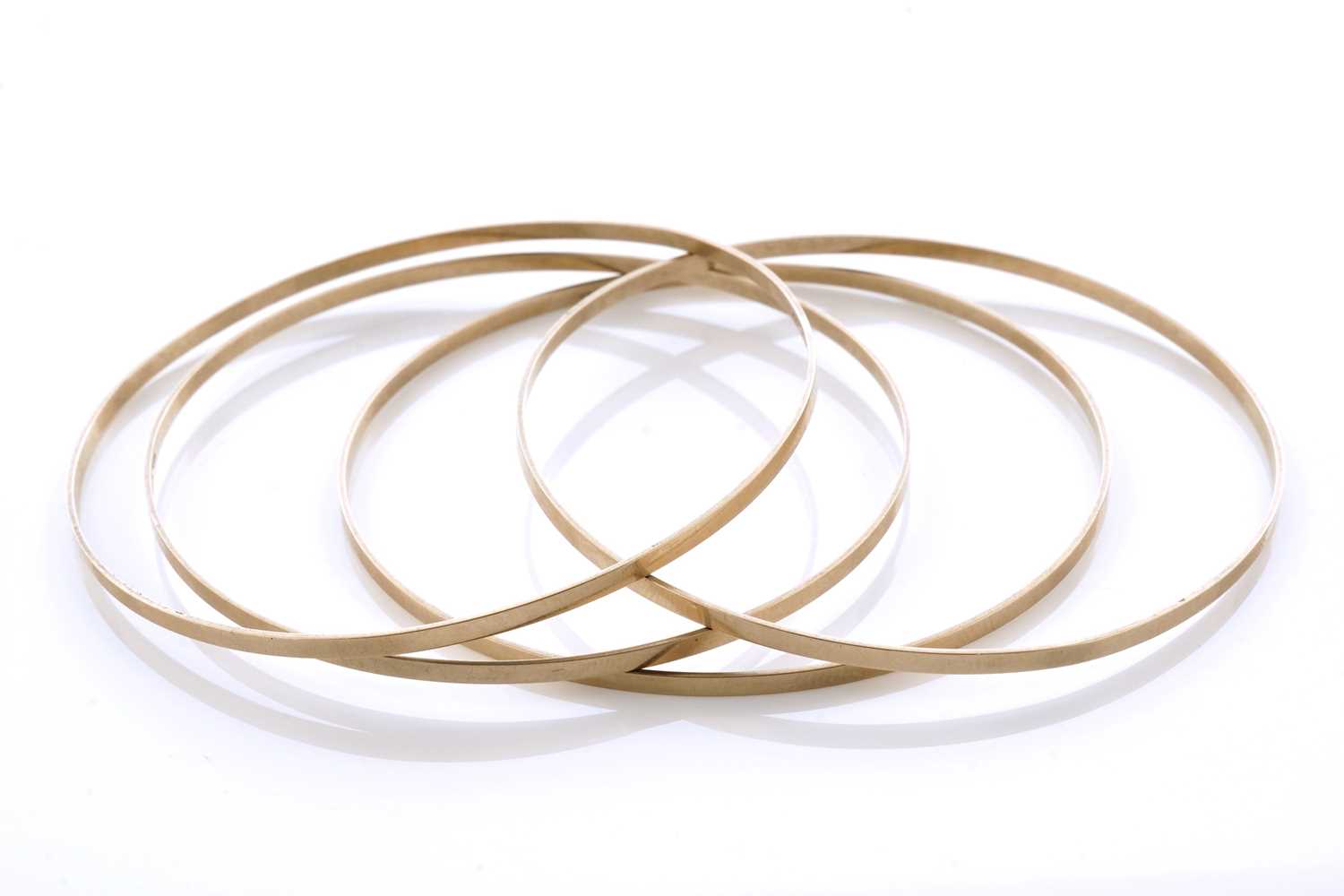 Lot 11 - A set of four 9ct yellow gold bangles
