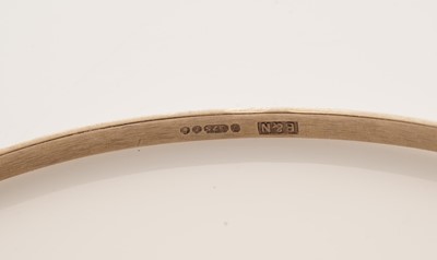 Lot 11 - A set of four 9ct yellow gold bangles