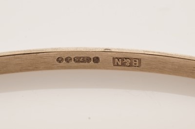 Lot 11 - A set of four 9ct yellow gold bangles
