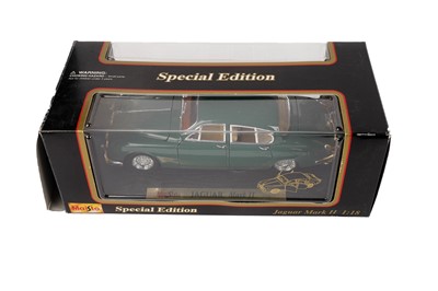 Lot 142 - A collection of diecast model cars, primarily scale 1:18 including: Corgi and Bburago