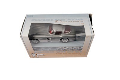 Lot 142 - A collection of diecast model cars, primarily scale 1:18 including: Corgi and Bburago