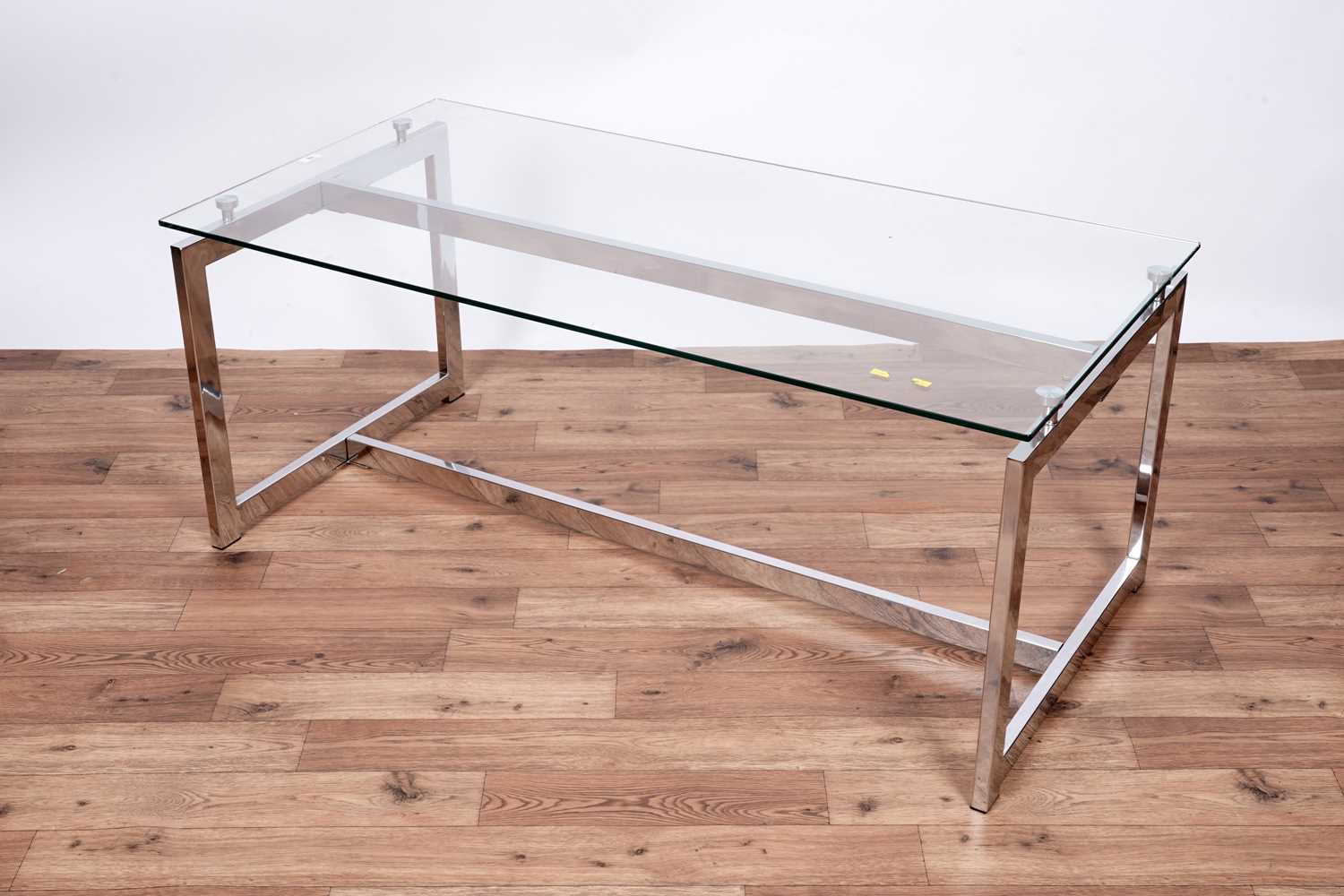 Lot 13 - A mid-20th Century style chrome and glass coffee table