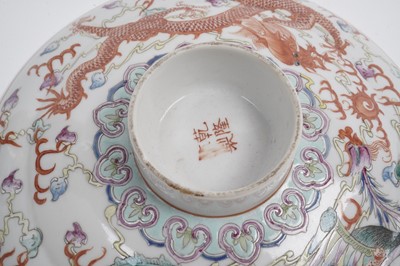 Lot 850 - A pair of Chinese famille rose bowls and covers