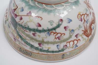 Lot 850 - A pair of Chinese famille rose bowls and covers