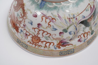 Lot 850 - A pair of Chinese famille rose bowls and covers