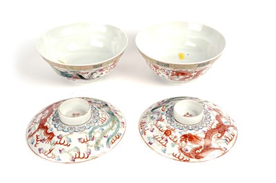 Lot 850 - A pair of Chinese famille rose bowls and covers