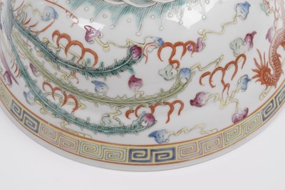 Lot 850 - A pair of Chinese famille rose bowls and covers